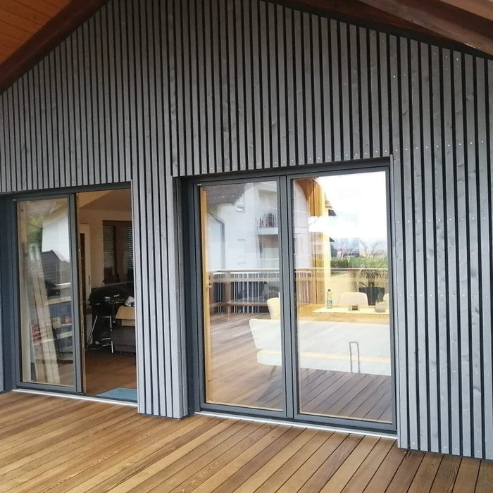 Wood facade Siberian larch slats chamfered in Nordic Gray 