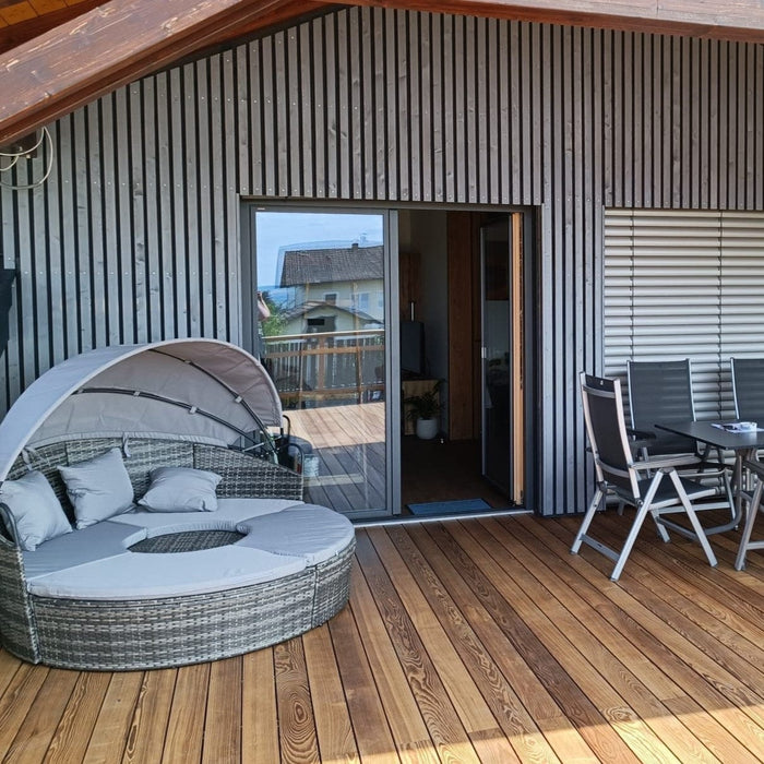 Wood facade Siberian larch slats chamfered in Nordic Gray 